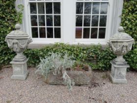 Pair of composition lidded urns decorated with swags and lion masks raised on pedestals {H 124cm x W