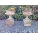 Pair of early 20th C. composition urns on square pedestals {68 cm H x 46 cm Dia.}.