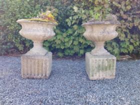 Pair of early 20th C. composition urns on square pedestals {68 cm H x 46 cm Dia.}.