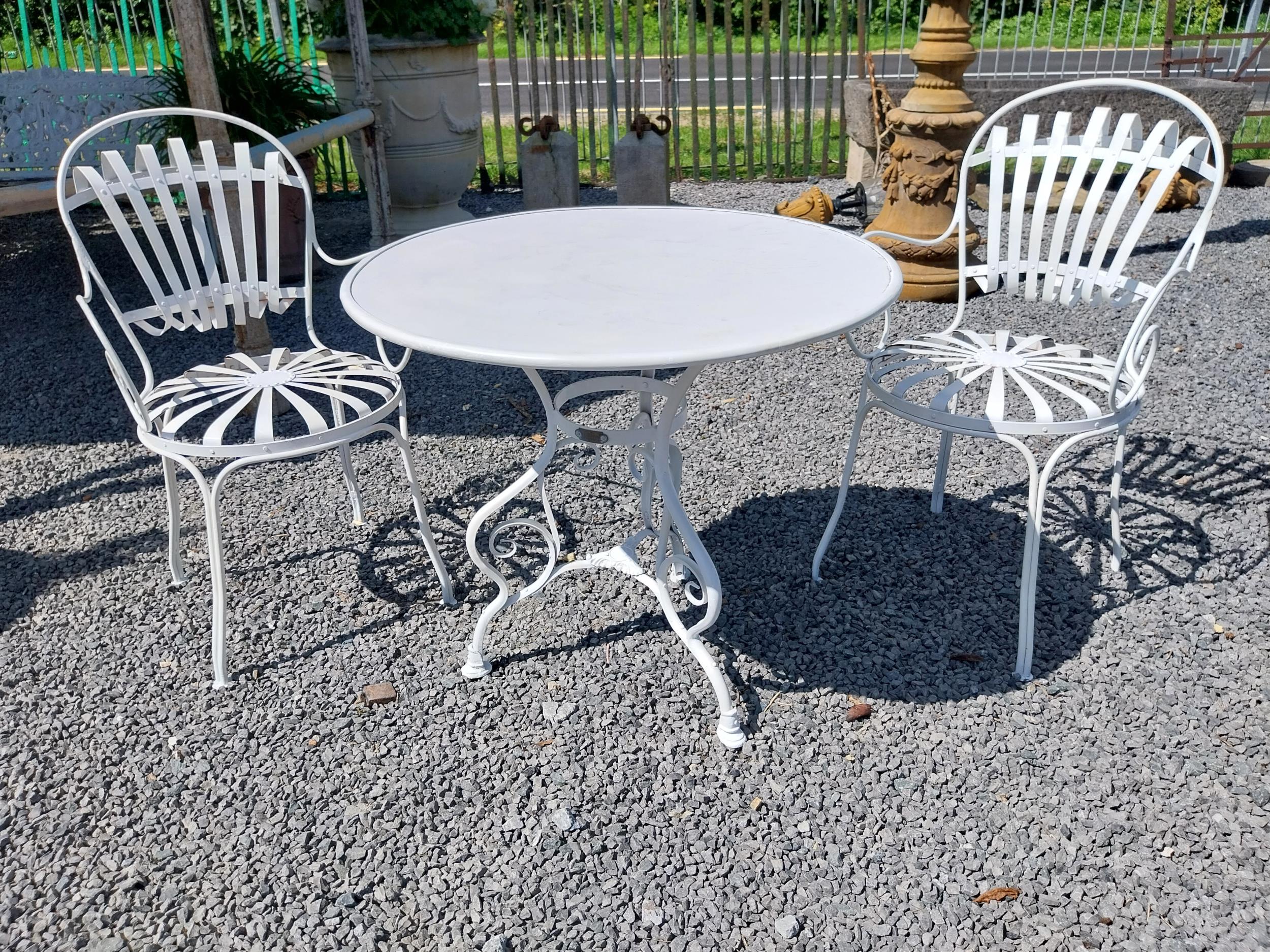 Exceptional quality hand forged wrought iron Arras style circular garden table and two matching