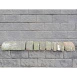 Collection of nine sandstone wall copings bull nose half round {Total length 1.7 metres}. (NOT