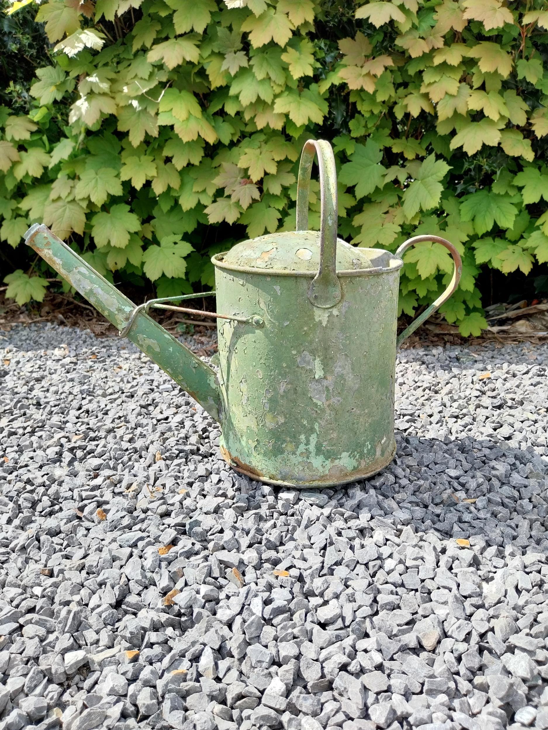 Metal watering can and cast iron wheel barrow wheel {39 cm H x 49 cm W x 26 cm D and 36 cm W x 39 cm - Image 4 of 6