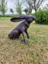 Exceptional quality bronze statue of a seated Hare scratching ear {36 cm H x 38 cm W x 23 cm D}.