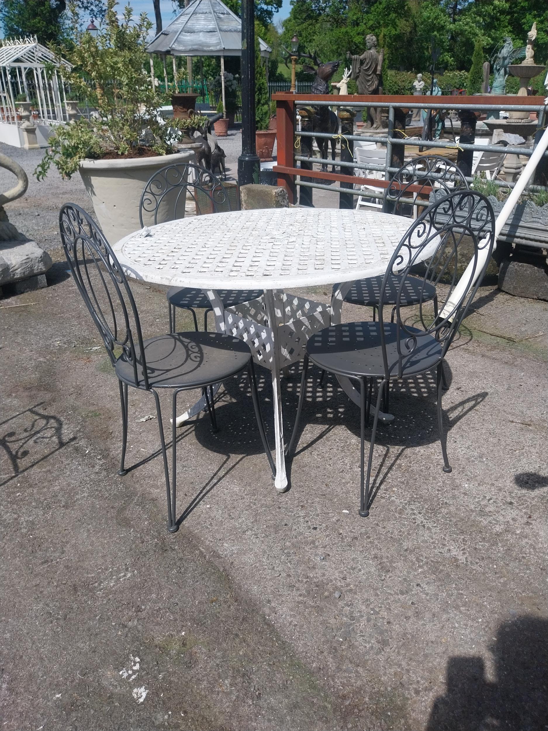 Cast iron aluminium garden table and four wrought iron garden chairs {Tbl. 73 cm H x 106 cm Dia. and - Image 4 of 4