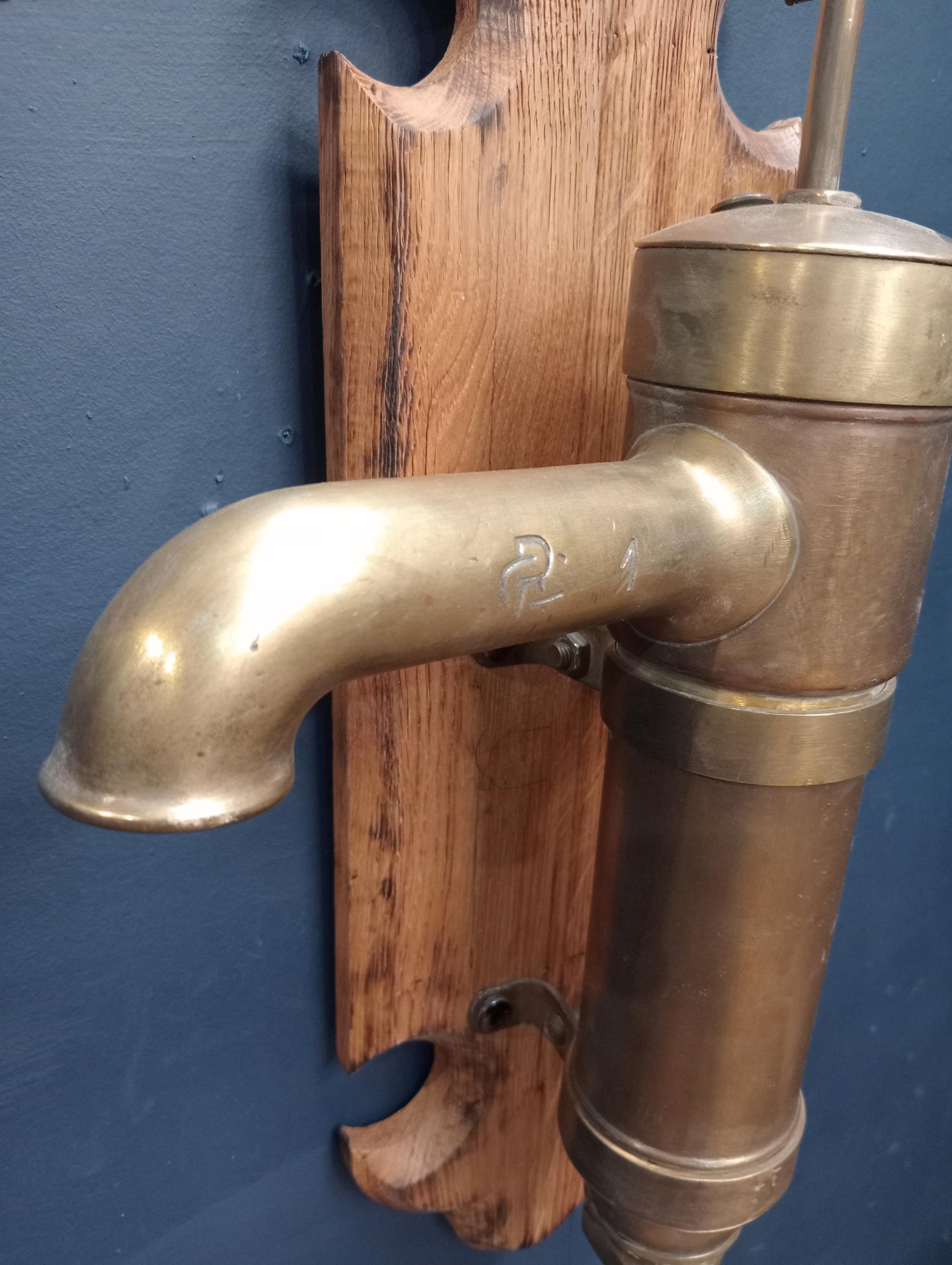 Brass water pump mounted on oak plaque {H 60cm x W 36cm x D 45cm }. (NOT AVAILABLE TO VIEW IN - Image 2 of 2