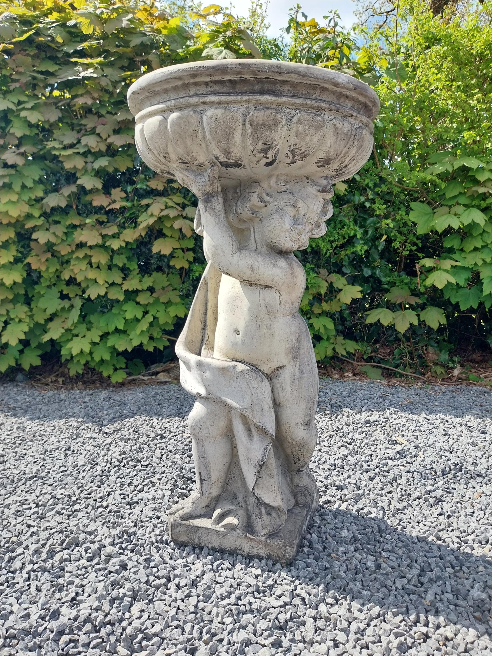 Moulded stone bird bath held of loft by Cherub {91 cm H x 49 cm Dia.}.