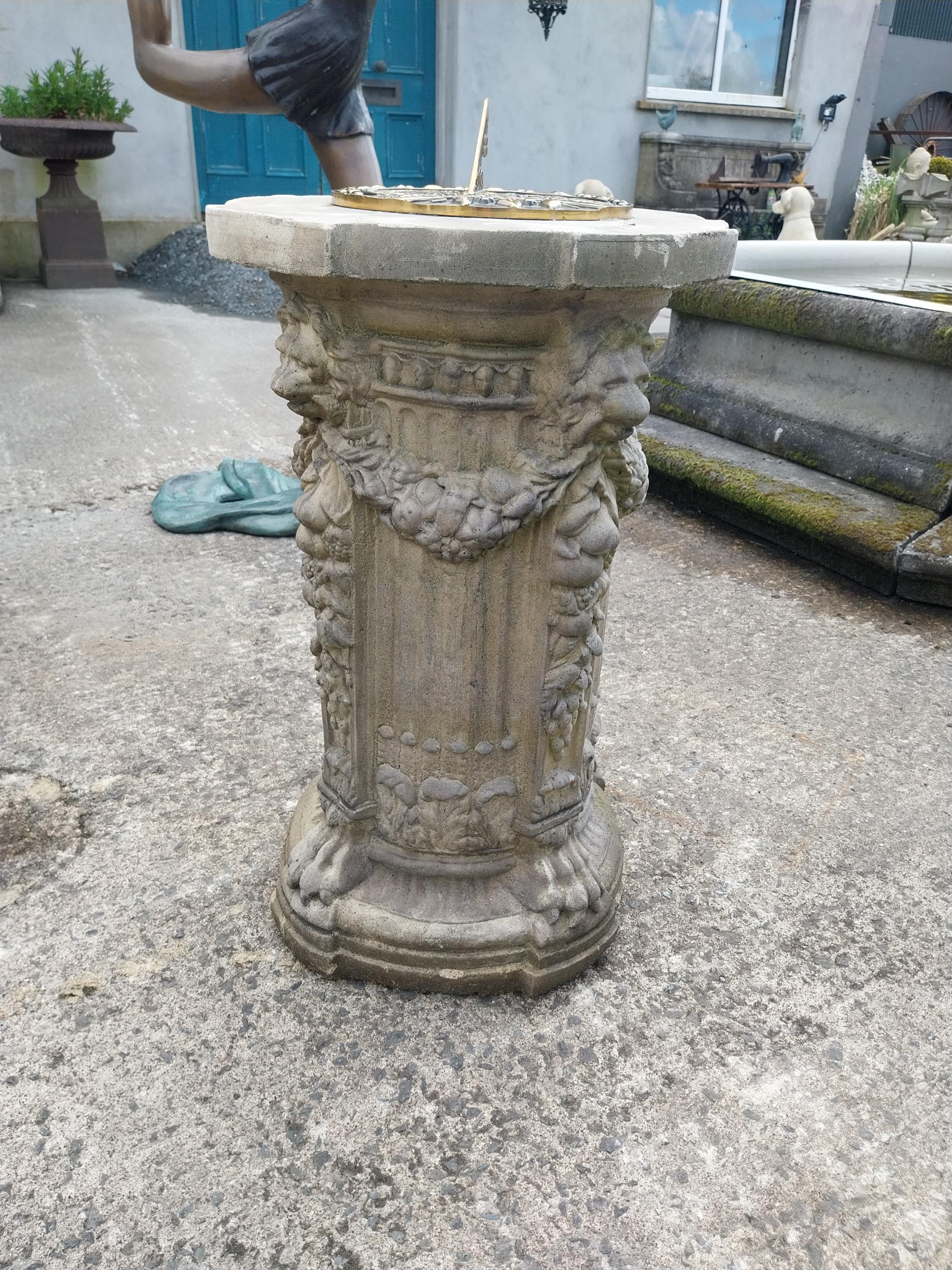 Good quality bronze sundial raised on moulded stone pedestal decorated with lions mask {78 cm H x 48