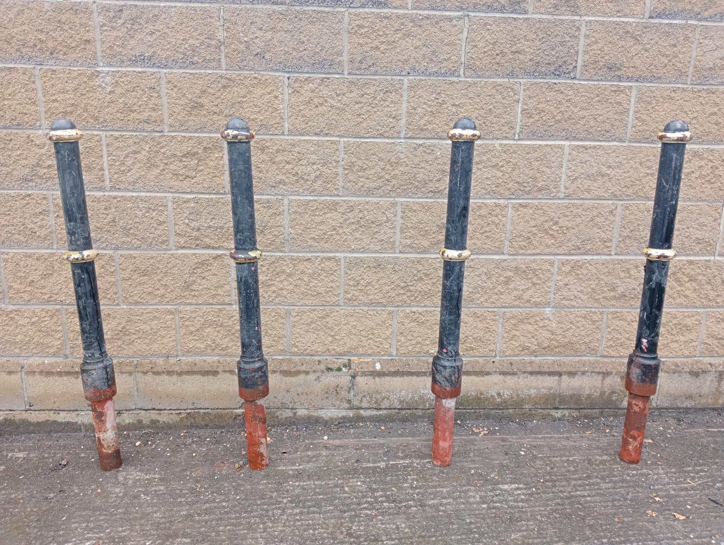 Four cast iron bollards {H 130cm x Dia 12cm }. (NOT AVAILABLE TO VIEW IN PERSON)