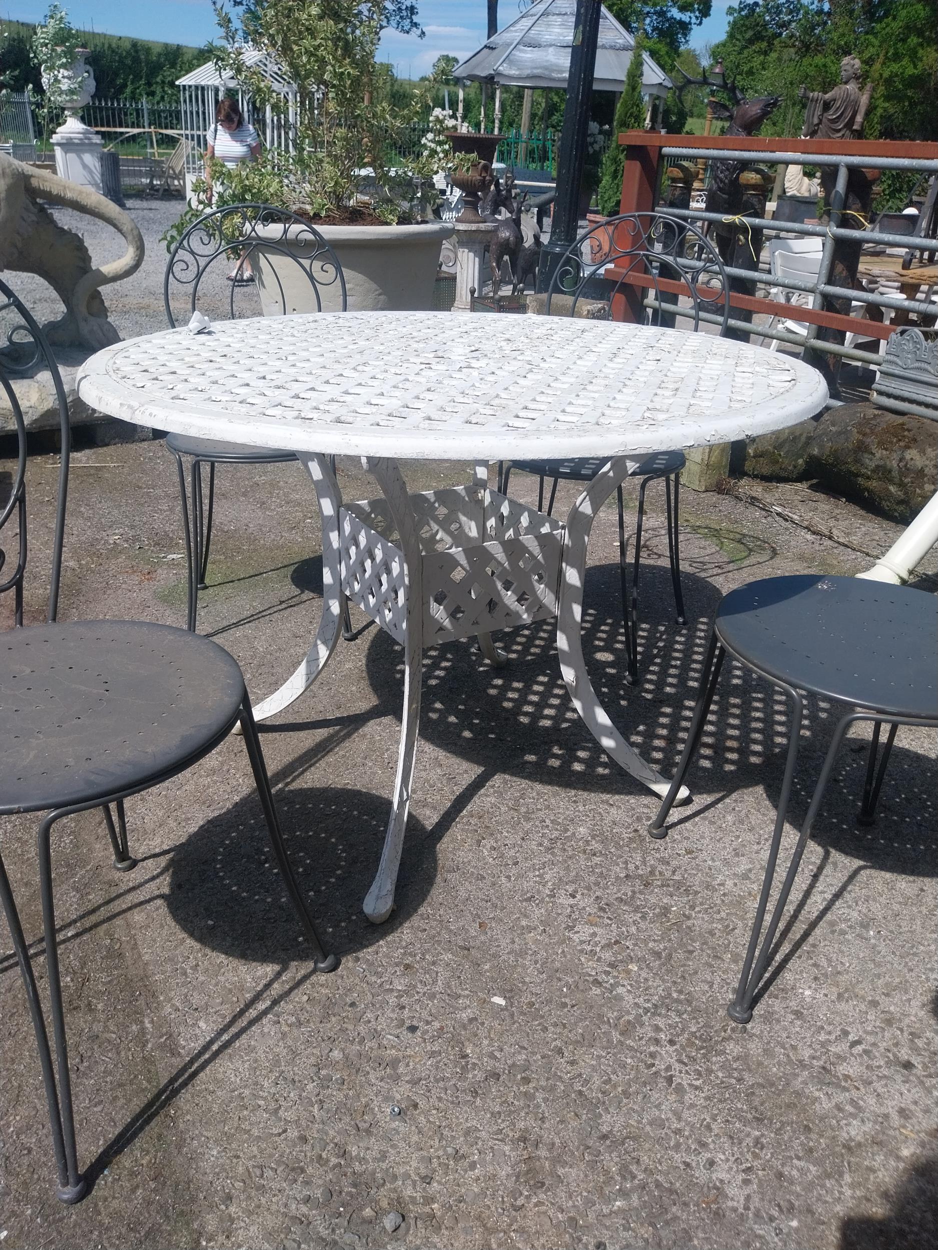 Cast iron aluminium garden table and four wrought iron garden chairs {Tbl. 73 cm H x 106 cm Dia. and - Image 2 of 4