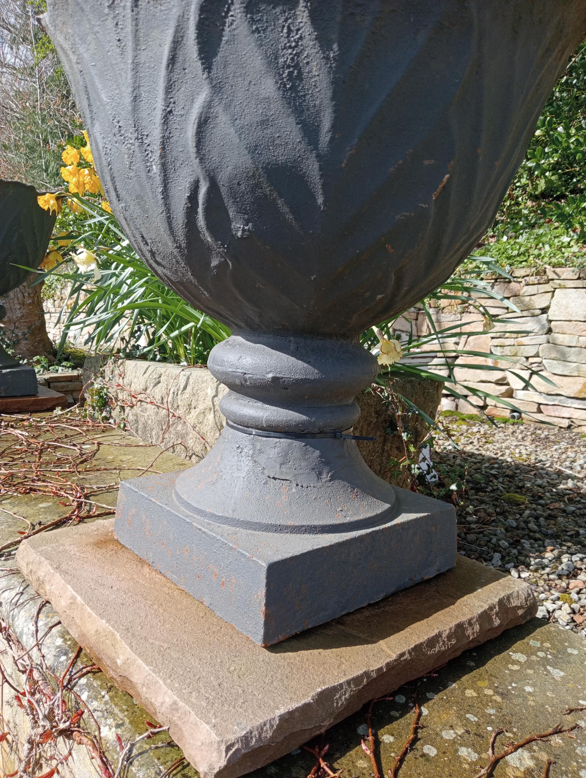 Pair of cast iron urns raised on sandstone pedestal {H 67cm x Dia 60cm }. (NOT AVAILABLE TO VIEW - Image 3 of 6