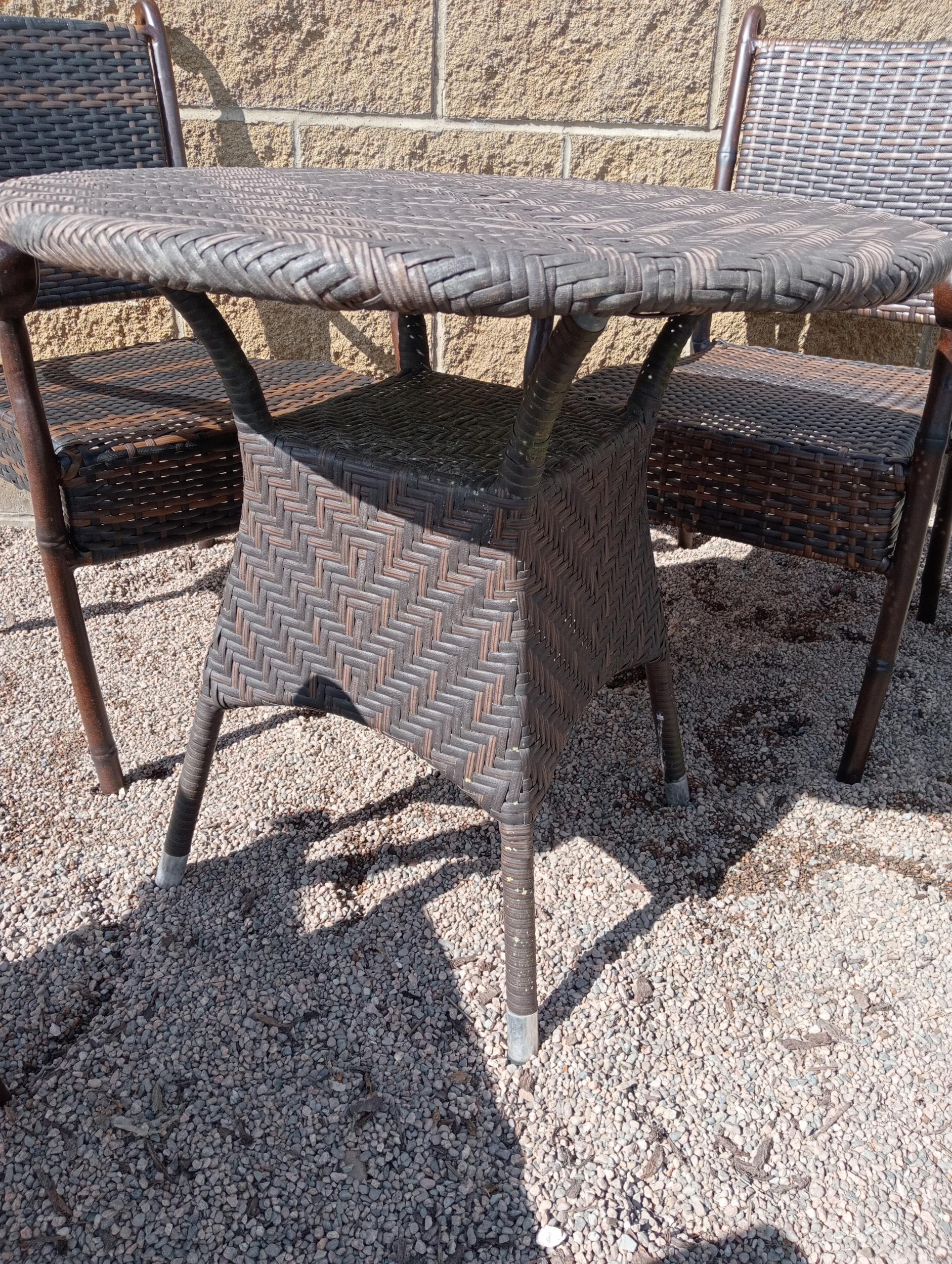 Rattan table and four rattan armchairs {Table H 70cm Dia 75cm Chairs H 86cm x W 57cm x D 52cm }. ( - Image 2 of 4