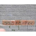 Collection of five terracotta copings with floral design {H 24cm x W 186cm x D 26cm}. (NOT AVAILABLE