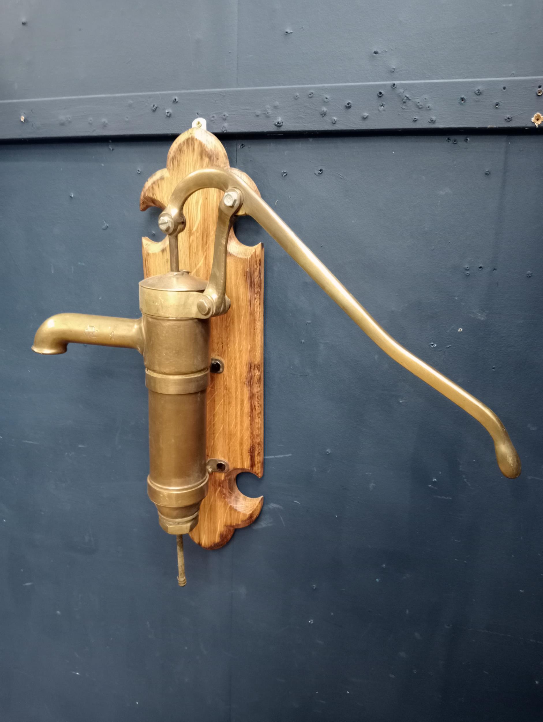 Brass water pump mounted on oak plaque {H 60cm x W 36cm x D 45cm }. (NOT AVAILABLE TO VIEW IN