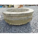 Good quality carved sandstone planter decorated with swags {37 cm H x 80 cm W x 61 cm D}.