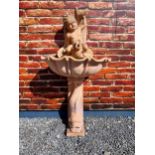 Pink marble wall fountain decorated with fish and boy {137 cm H x 70 cm W}. (NOT AVAILABLE TO VIEW