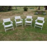 Set of four painted wooden folding garden armchairs {85 cm H x 66 cm W x 54 cm D}.