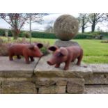 Pair of cast iron statuettes of Piglets {20 cm H x 43 cm W x 14 cm D}.