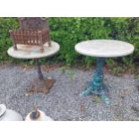 Two cast iron garden tables with zinc tops {74 cm H x 70 cm Dia. and 79 cm H x 70 cm Dia.}.