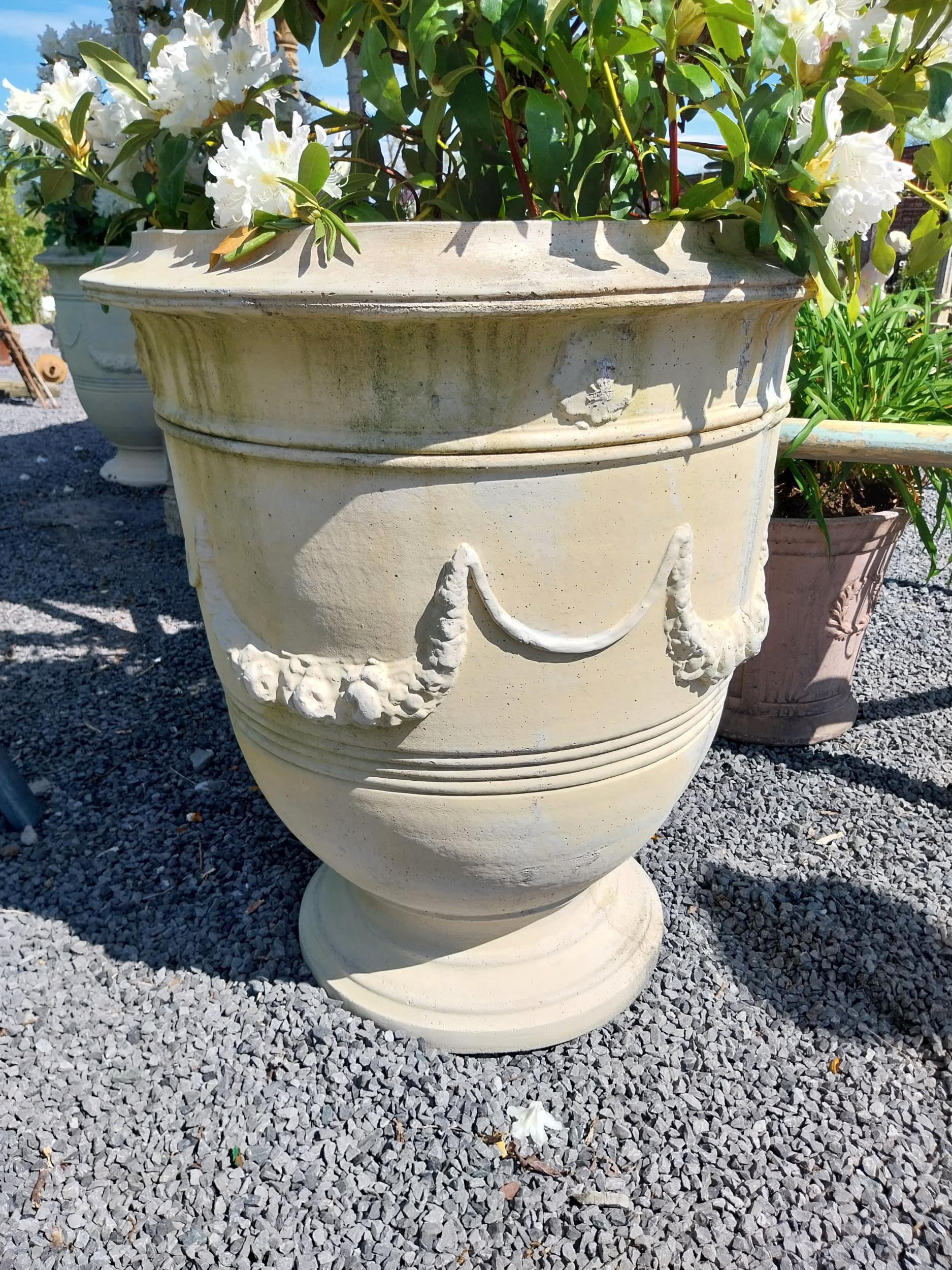 Pair of large moulded sandstone urns decorated with swags including plants {Urns dimensions 100 cm H - Image 3 of 5