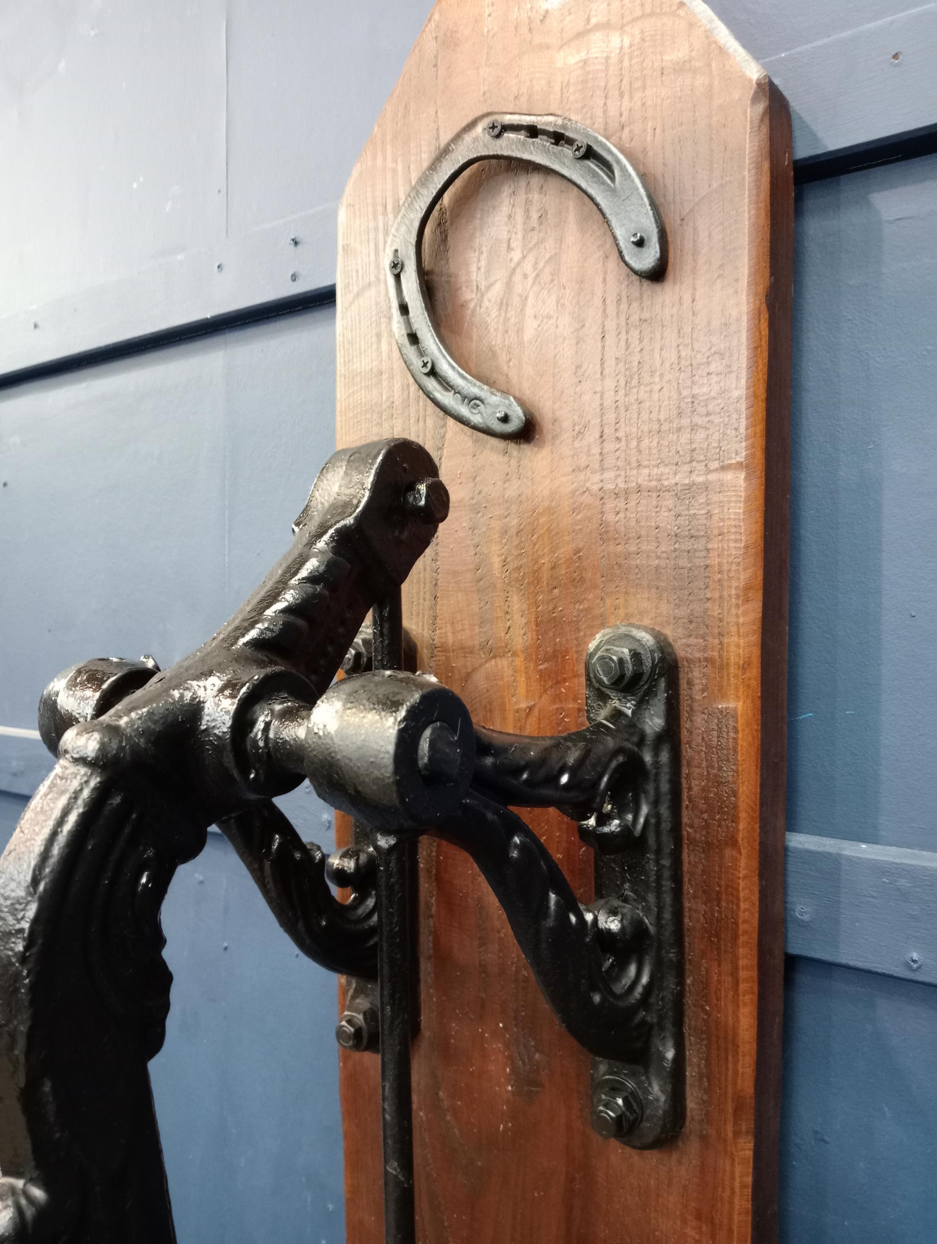 Ornate cast iron water pump mounted on wooden board{H 133cm x W 36cm x D 41cm }. (NOT AVAILABLE TO - Image 2 of 2
