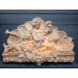 Ornate wall mounted plaque depicting musical cherubs {H150cm x W 232cm x D 36cm }. (NOT AVAILABLE TO