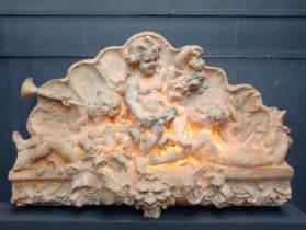Ornate wall mounted plaque depicting musical cherubs {H150cm x W 232cm x D 36cm }. (NOT AVAILABLE TO