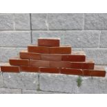 Collection of one hundred and ten red glazed bricks {H 8cm x W 23cm x D 11cm }.