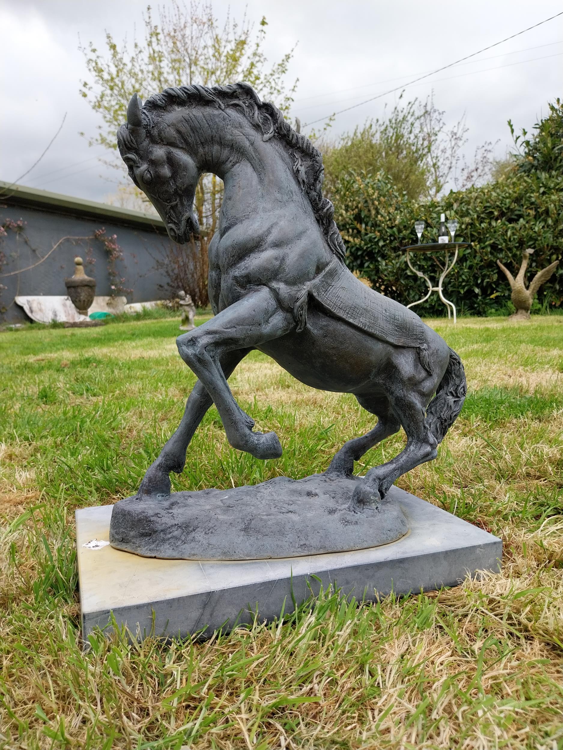 Bronze sculpture of a rearing Horse mounted on slate base {52 cm H x 41 cm W x 26 cm D}. - Image 3 of 6