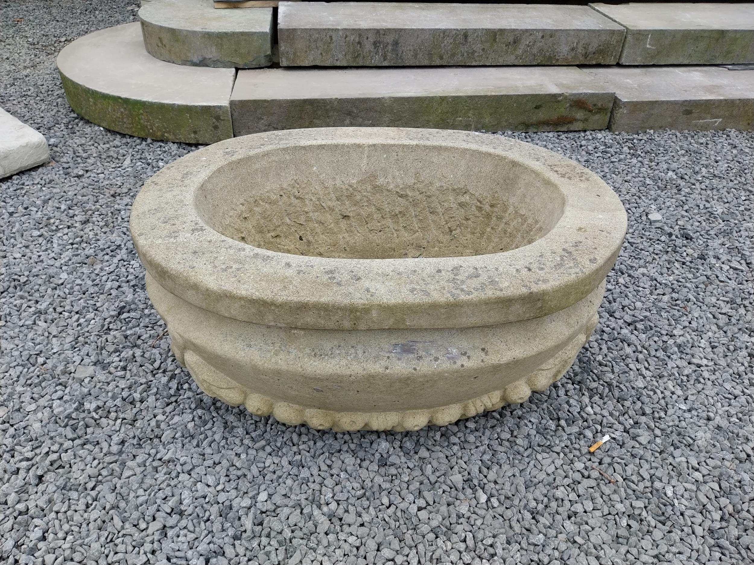 Good quality carved sandstone planter decorated with swags {37 cm H x 80 cm W x 61 cm D}. - Image 2 of 7