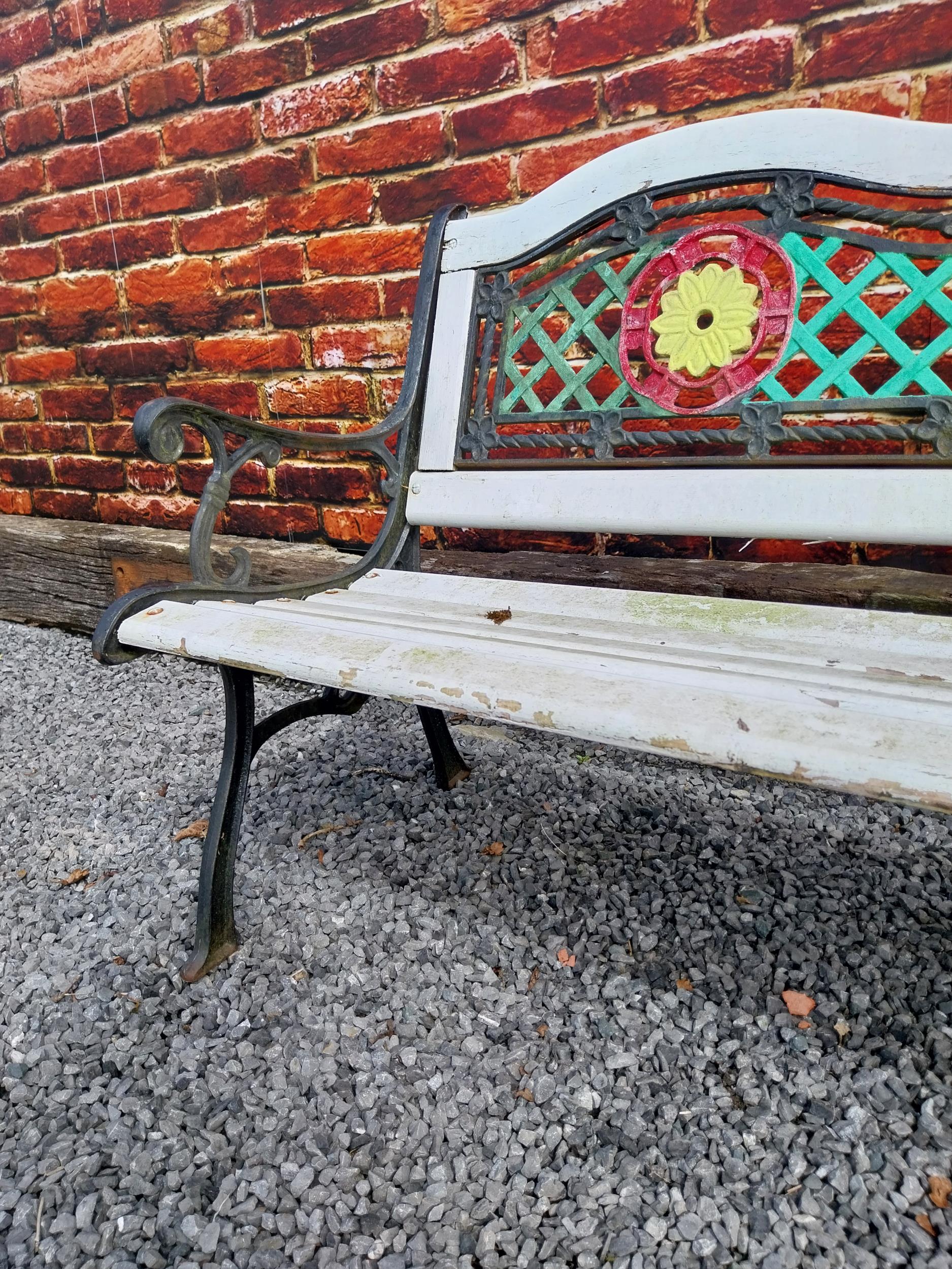 1950s cast iron garden bench with wooden slats decorated with flowers {80 cm H x 128 cm W x 60 cm - Image 2 of 3