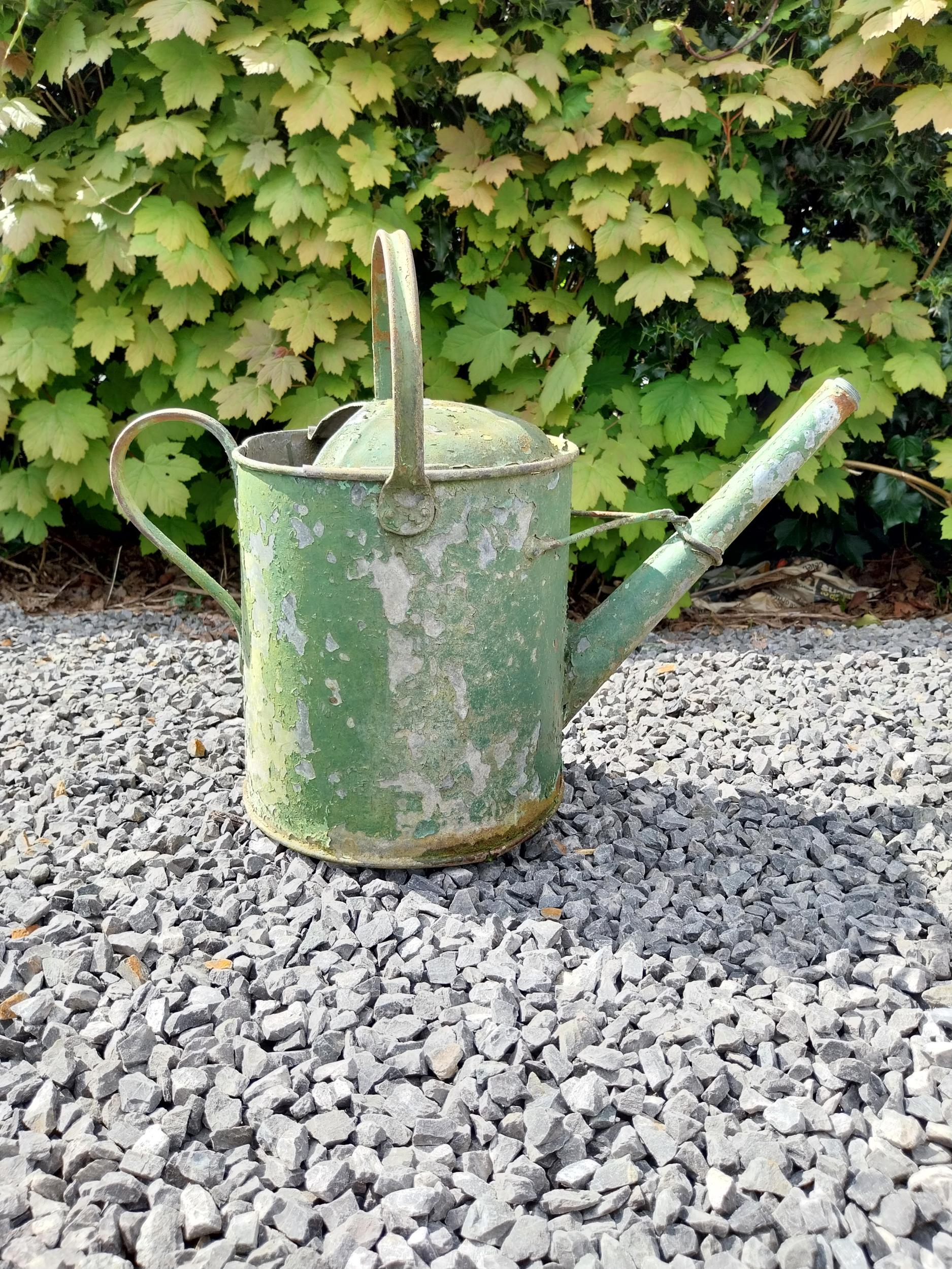 Metal watering can and cast iron wheel barrow wheel {39 cm H x 49 cm W x 26 cm D and 36 cm W x 39 cm - Image 3 of 6