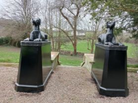 Pair of cast iron statues of Dogs raised on plinths {H 163cm x W 64cm x D 145cm Dogs H 66cm x W 46cm