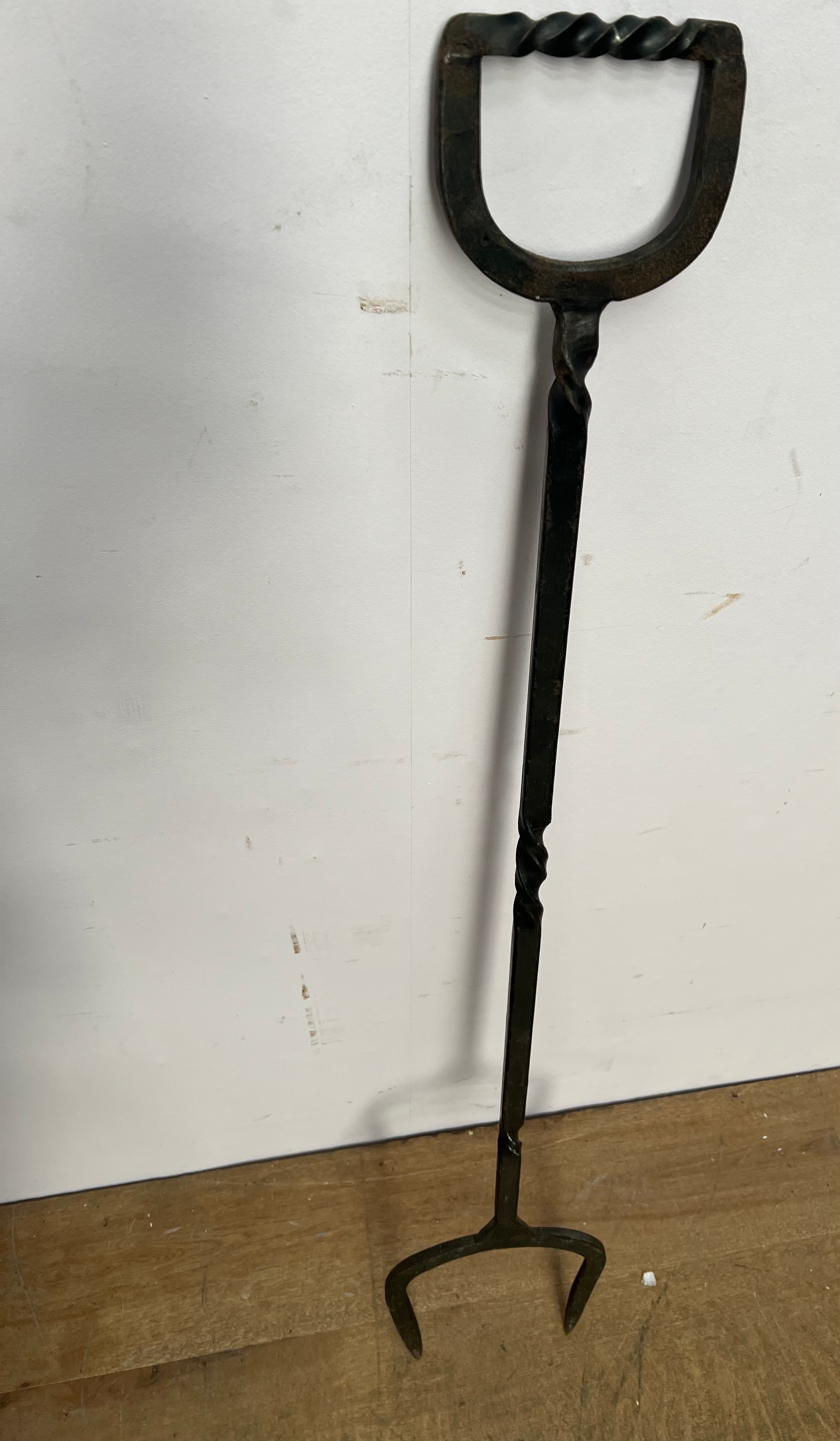 Wrought iron fork {H 119cm x W23cm x D 1cm}. (NOT AVAILABLE TO VIEW IN PERSON)