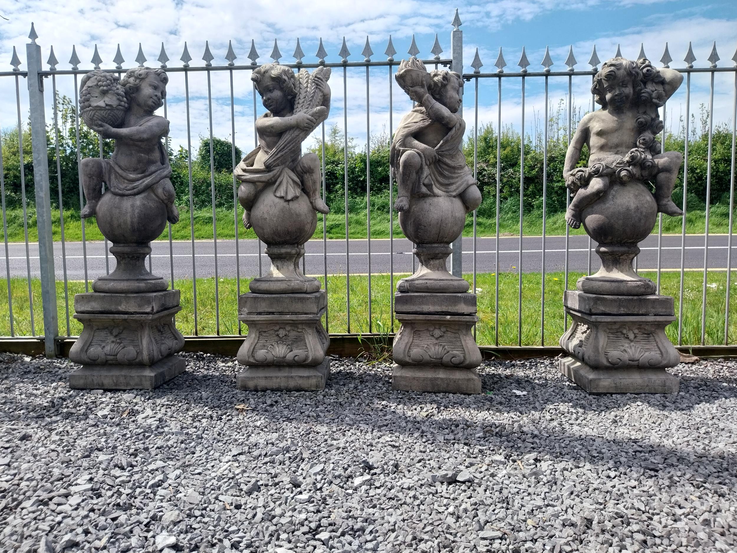 Set of four good quality moulded stone statues of Cherubs depicting the four seasons raised on