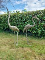 Two bronze statues of Storks {120 cm H x 18 cm W x 53 cm D and 89 cm H x 18 cm W x 56 cm D}.