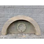 Large semi circular stone surround top with decorative centre piece {H 79cm x W 154cm x D 34cm }. (