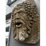 Pair of early 20th C. moulded stone wall masks