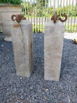 Pair of 19th C. hand-cut limestone bollards with wrought iron tops {72 cm H x 21 cm W x 21 cm D}.