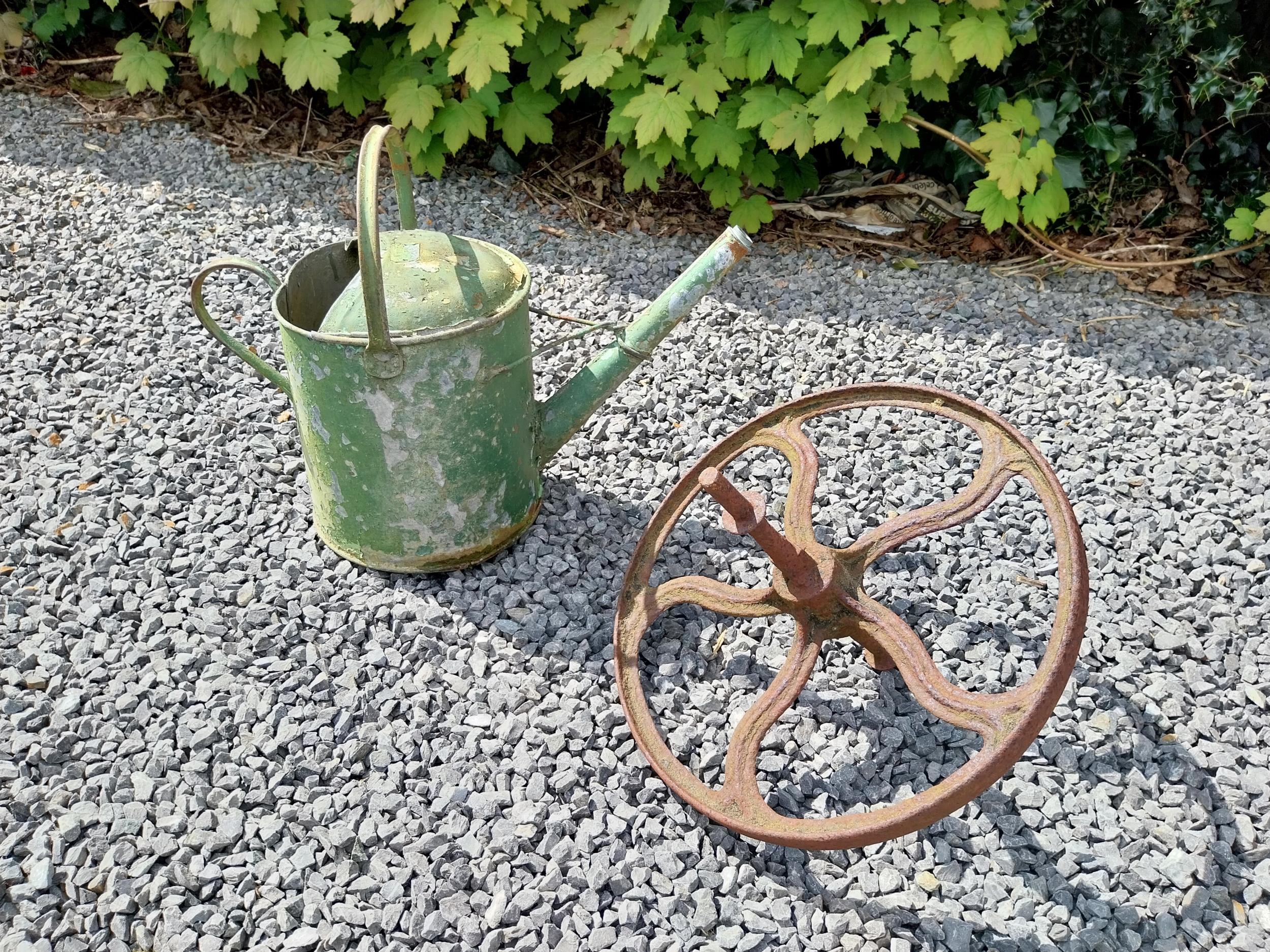 Metal watering can and cast iron wheel barrow wheel {39 cm H x 49 cm W x 26 cm D and 36 cm W x 39 cm - Image 2 of 6