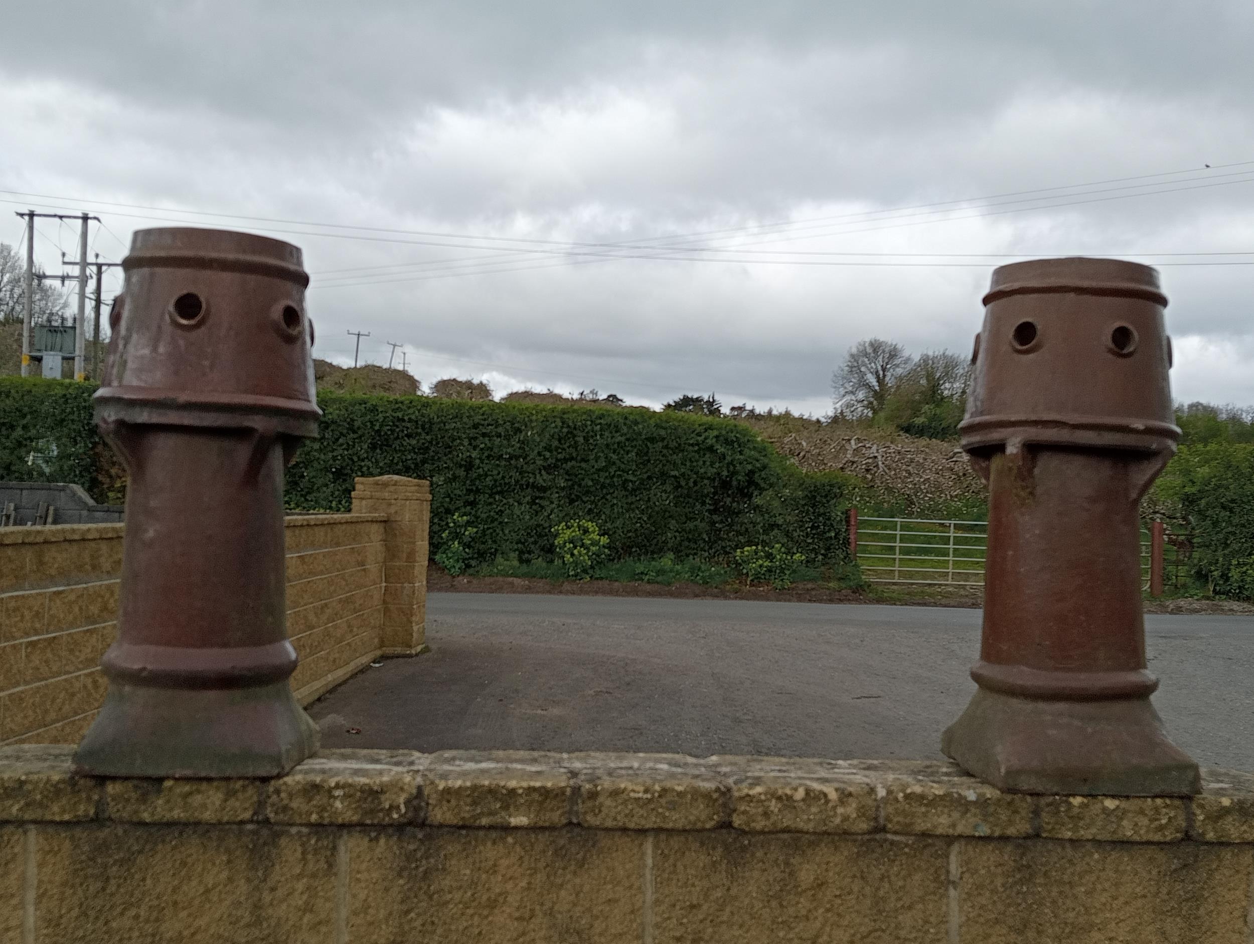 Pair of terracotta chimney pots {H 86cm x W 30cm x D 30cm }. (NOT AVAILABLE TO VIEW IN PERSON)