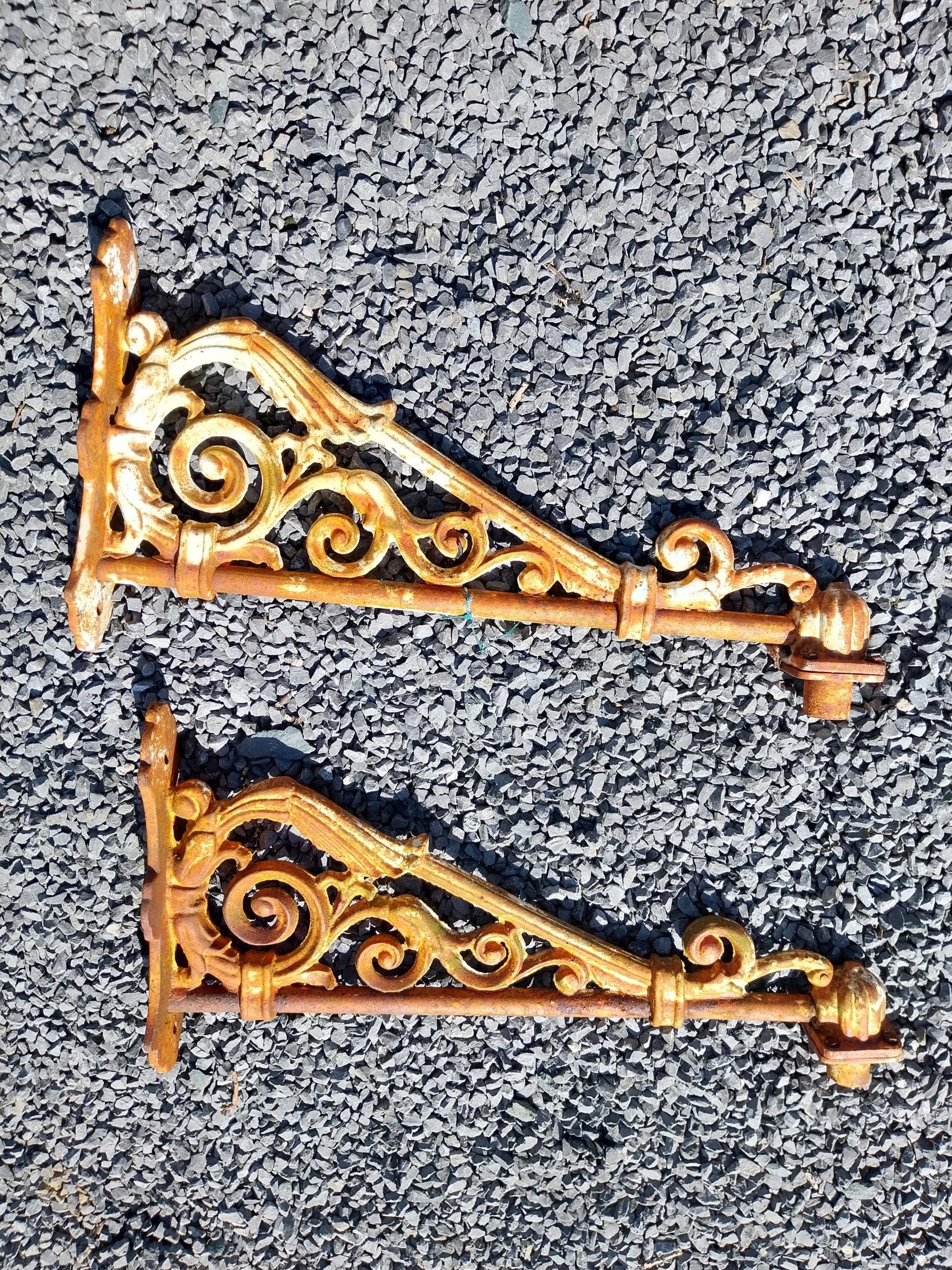 Pair of good quality decorative cast iron wall brackets {39 cm H x 72 cm W x 11 cm D}.