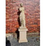 Moulded sandstone Venus de Milo statue raised on pedestal {200 cm H x 47 cm W x 47 cm D}.