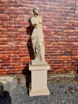 Moulded sandstone Venus de Milo statue raised on pedestal {200 cm H x 47 cm W x 47 cm D}.