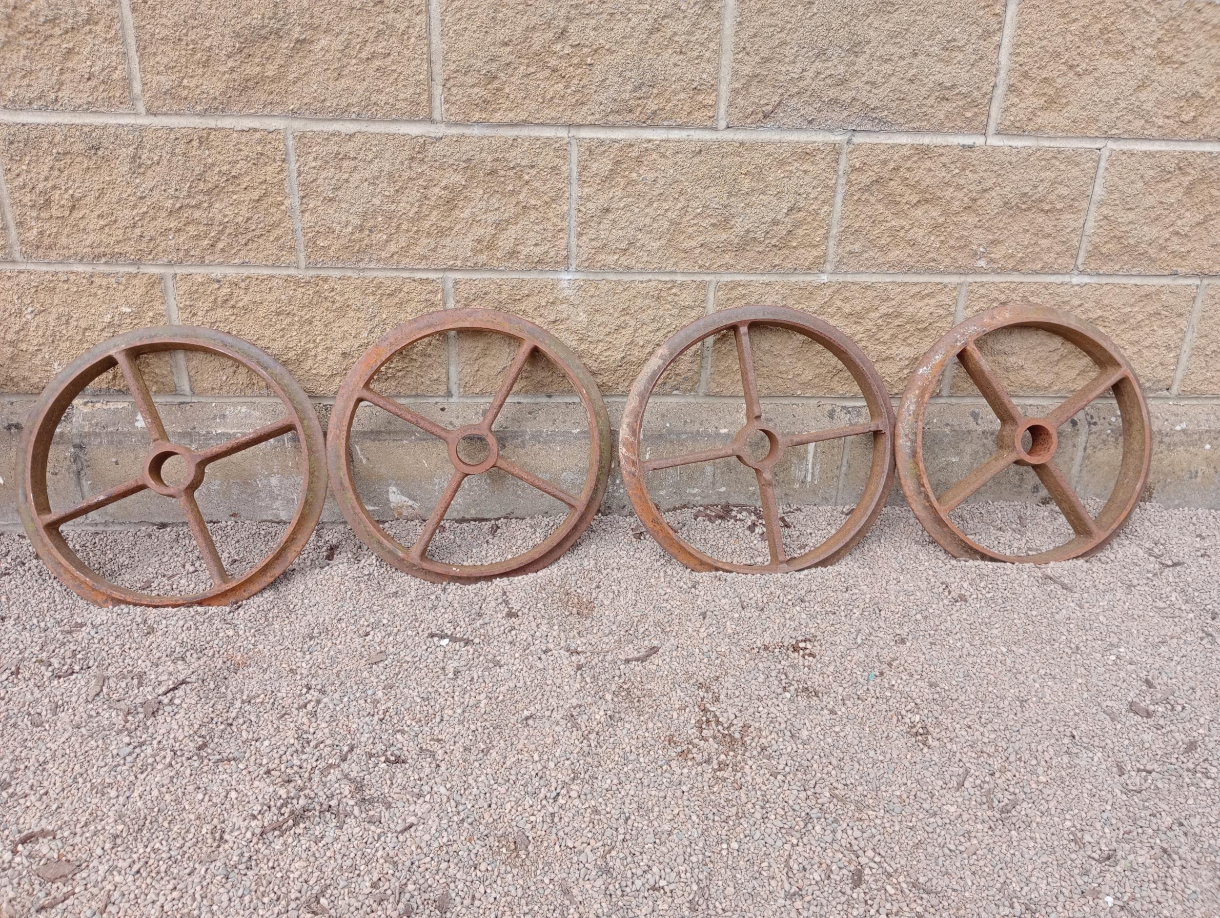 Collection of four cast iron Shepard hut wheels {Dia 49cm x D 6cm }. (NOT AVAILABLE TO VIEW IN