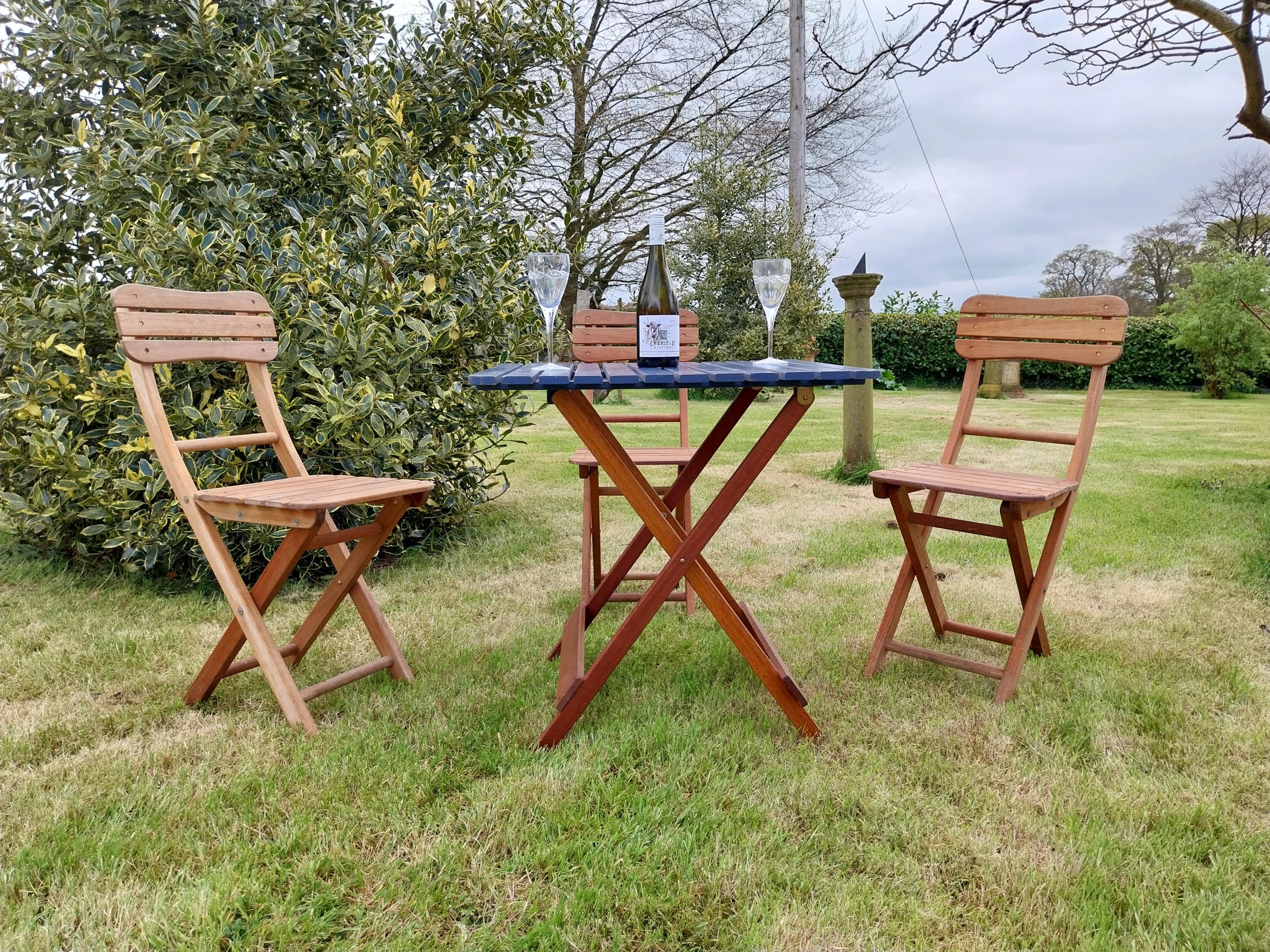 Good quality teak folding garden table with three matching garden chairs {Tbl. 71 cm H x 68 cm W x