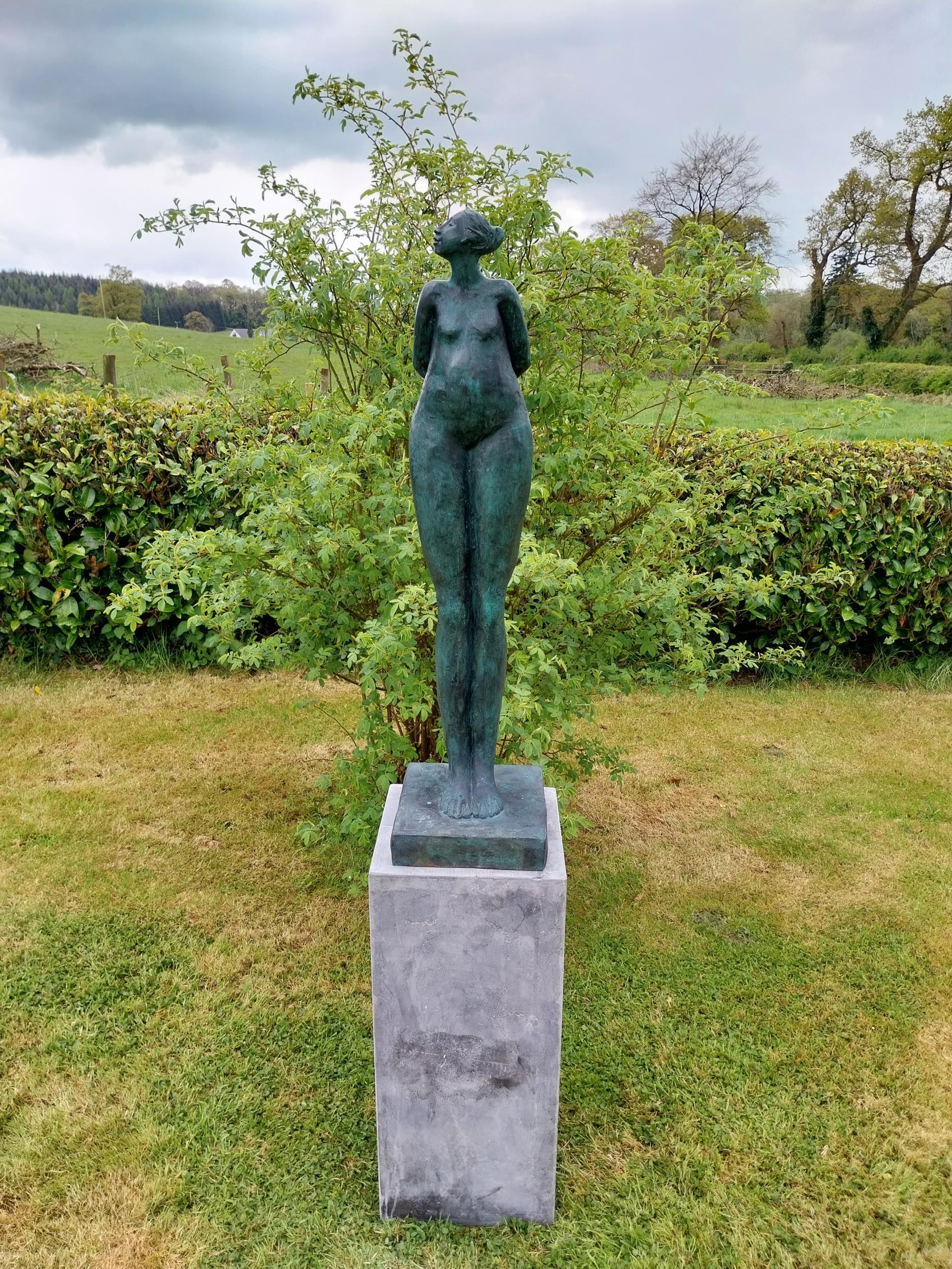 Exceptional quality contemporary bronze sculpture of a Lady with her head turned and arms folded