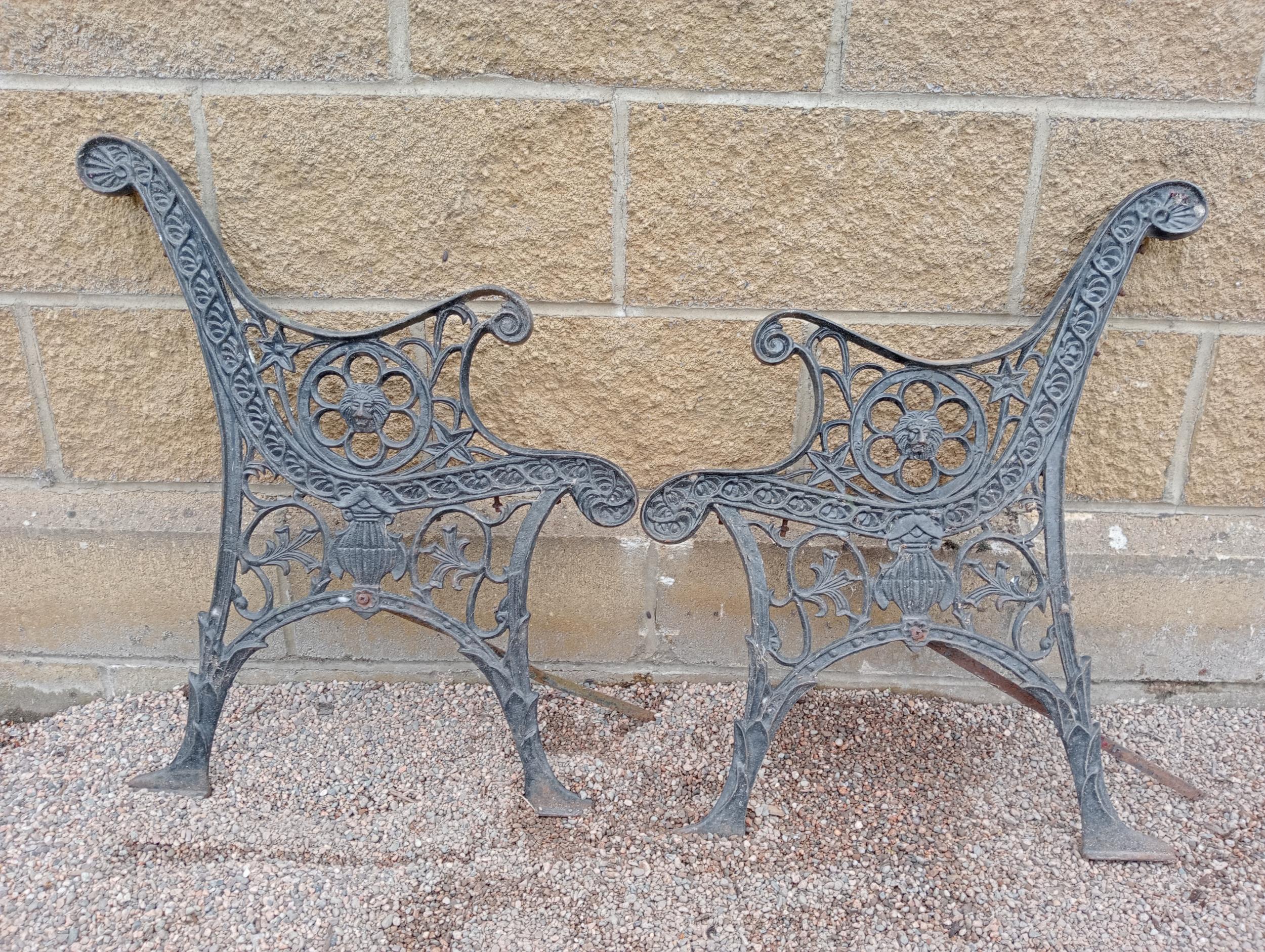 Pair of cast iron bench ends with decorated with lions heads {H 73cm x D 60cm }. (NOT AVAILABLE TO