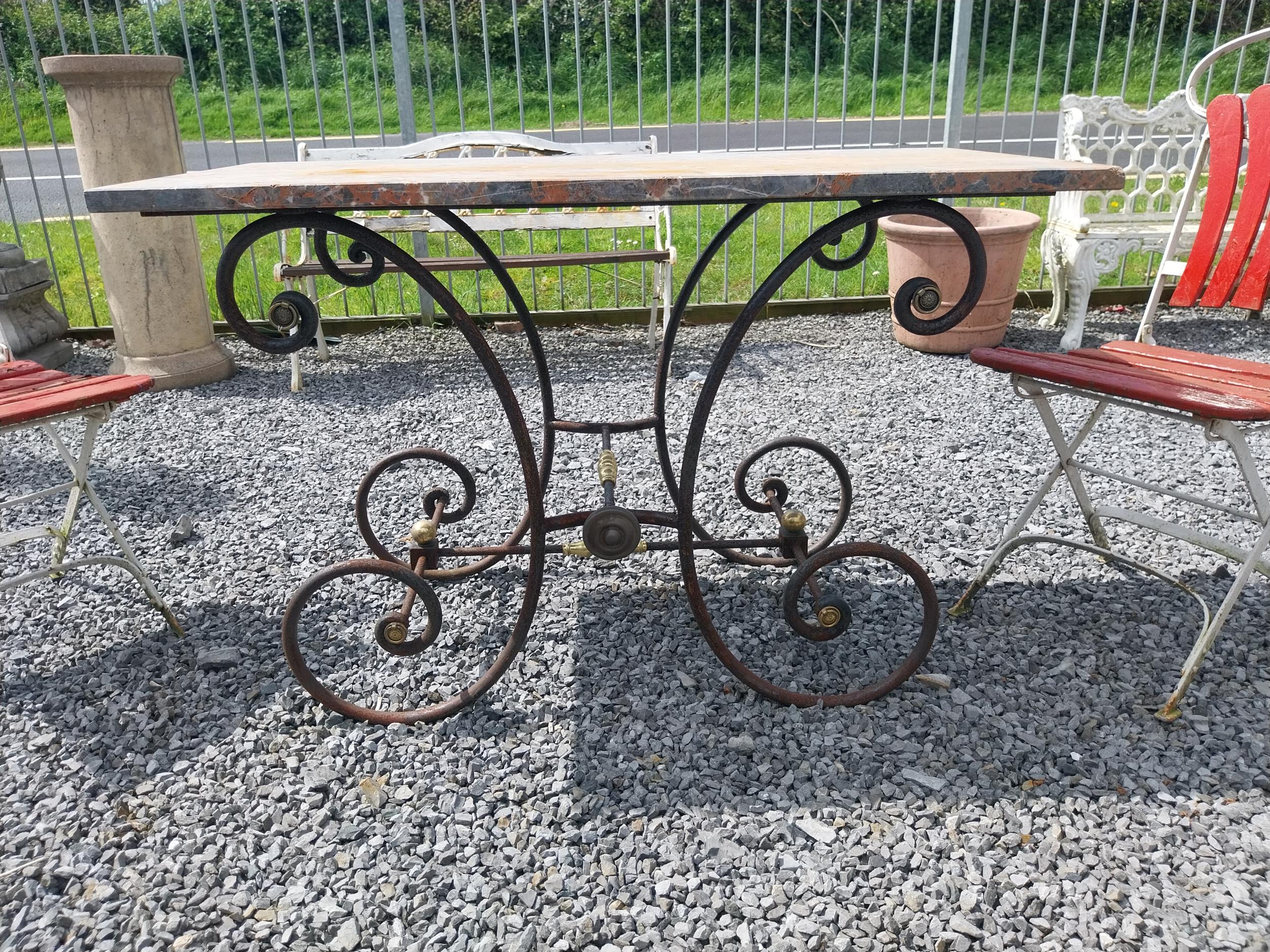 Good quality wrought iron and brass butchers table with marble top {76 cm H x 120 cm W x 60 cm D}.