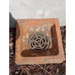 Terracotta drain gully with original cast iron grate cover {H 10cm x W 62cm x D 46cm }. (NOT