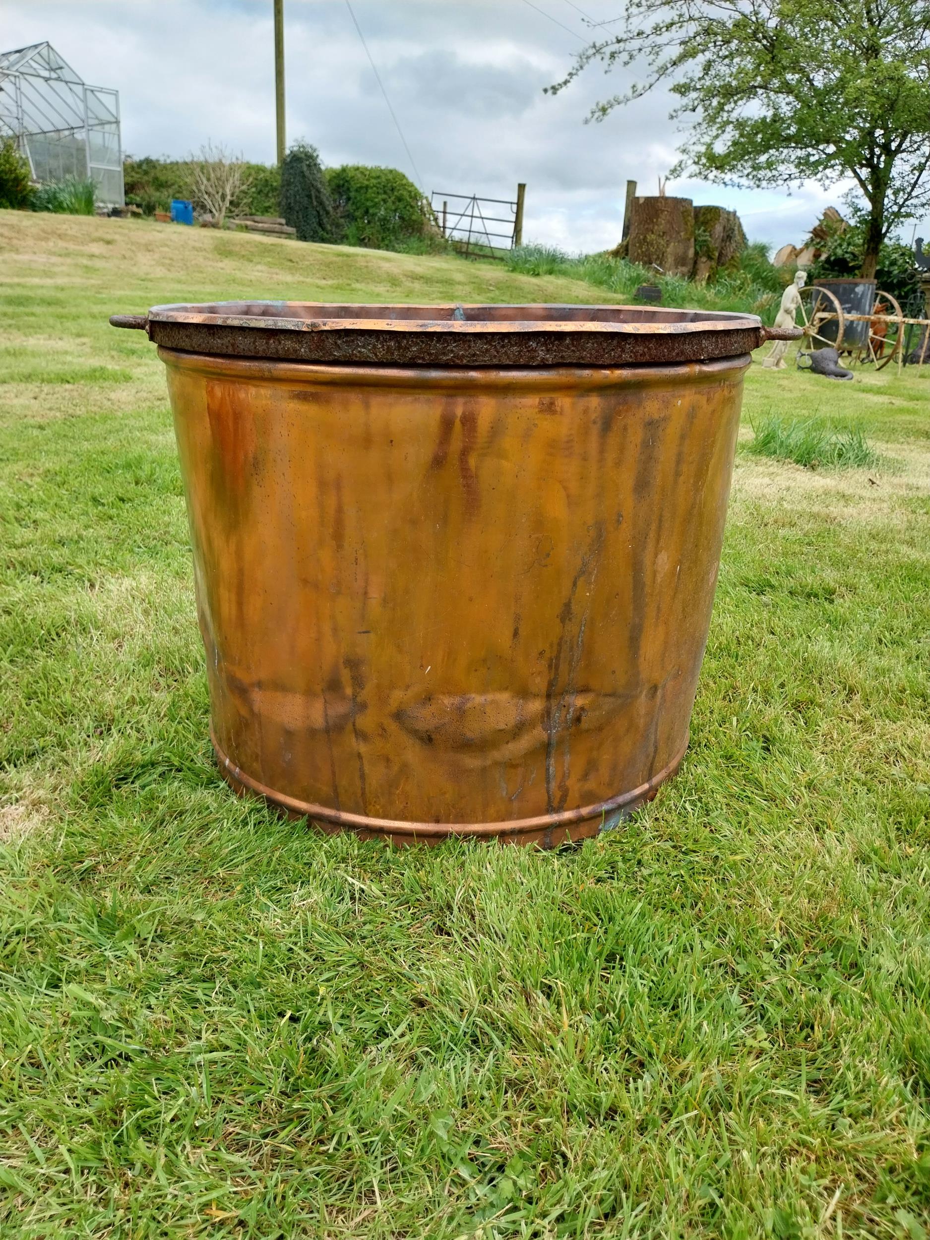 Large circular copper garden planter {53 cm H x 78 cm W x 67 cm D}.